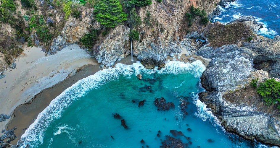 Aerial coastal landscape showing cliffs, beach and ocean