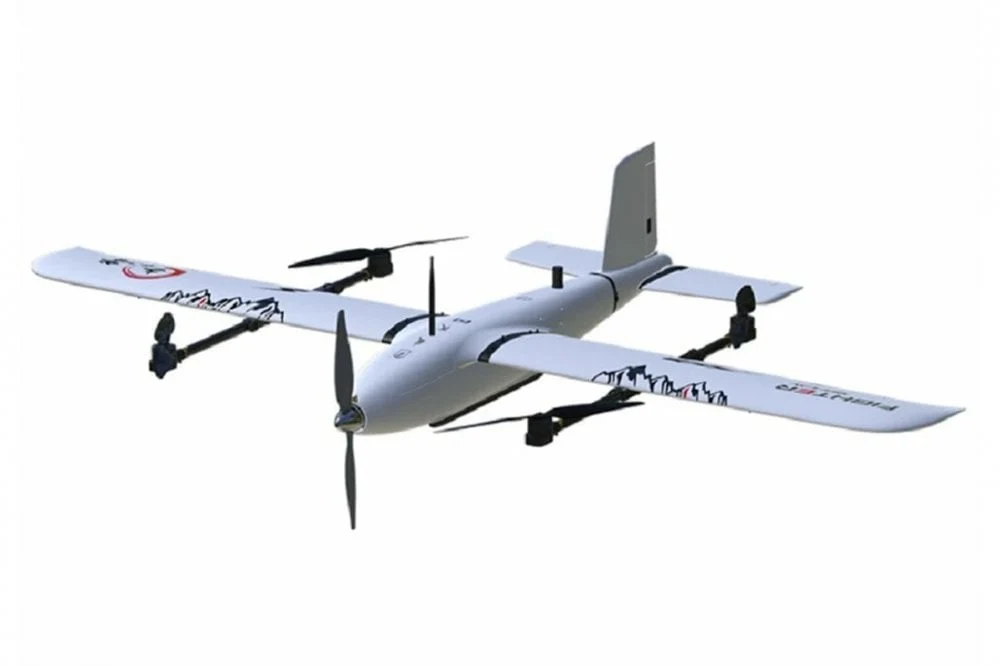 White fixed-wing VTOL aircraft with lift motors and a front propeller